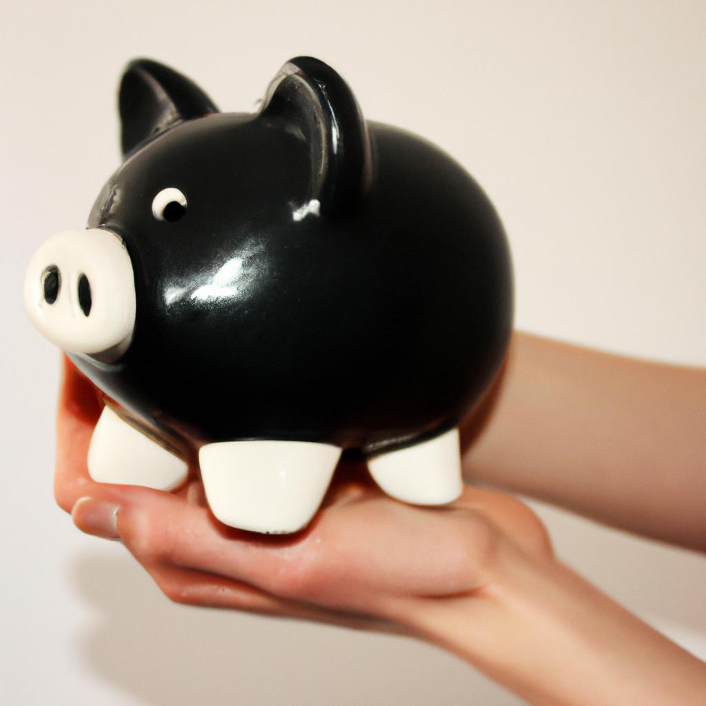 Person holding a piggy bank